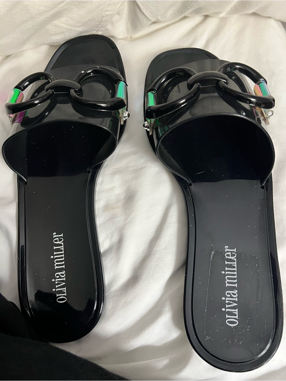 Olivia Miller Black Chain-Link Slide Sandals featuring holographic hardware.